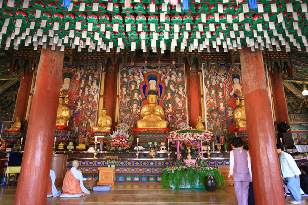 Traditional Korean temple interior visit during a South Korea guided motorcycle tour, featuring cultural stops on a 12-day motorbike tour in Korea.