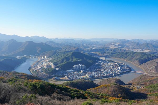 Panoramic mountain viewpoint in South Korea during a guided motorcycle tour, showcasing scenic river valleys on a motorbike tour in Korea.